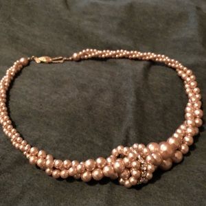 New and never worn. For a small neck